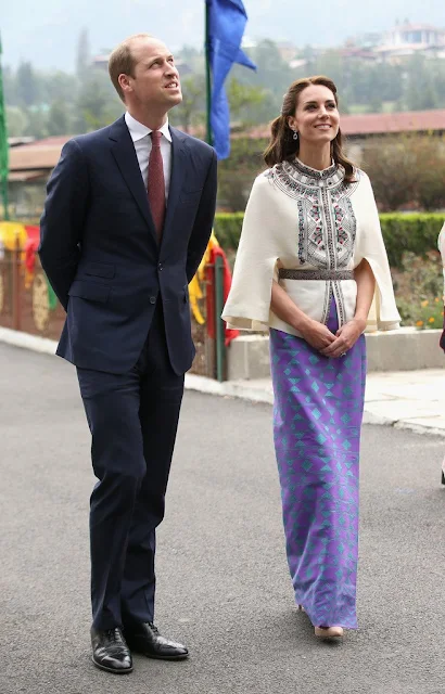 Britain's Prince William and Catherine, Duchess of Cambridge walk with King Jigme Khesar Namgyel Wangchuck and Queen Jetsun Pema