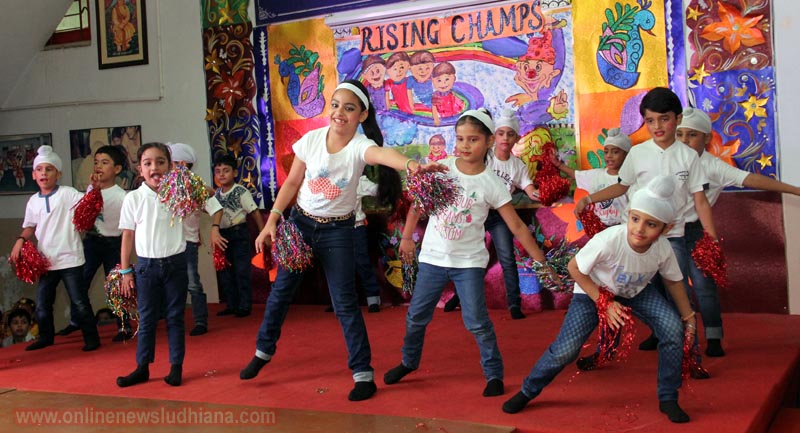 Students performing dance on stage during class presentation rising champs at BCM School Students performing dance on stage during class presentation rising champs at BCM School