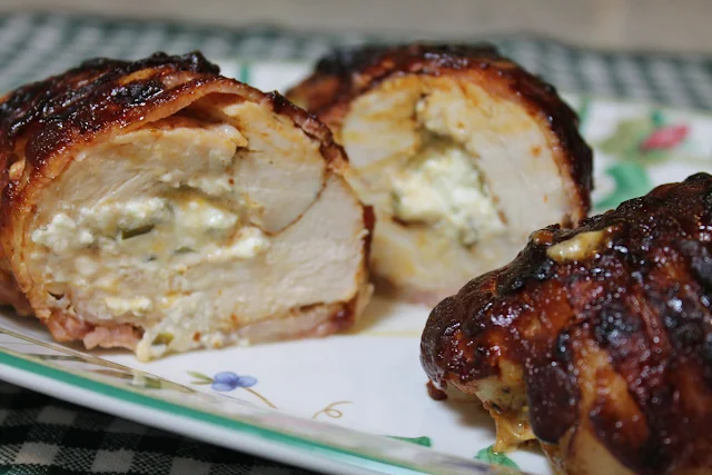A Bacon and Barbecue Sauce Wrapped Chicken Stuffed with a Jalapeno Cheese Mixture.