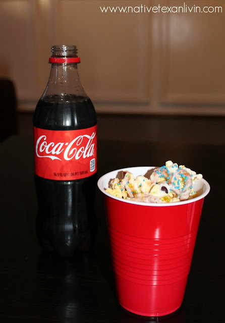 Coca-Cola & White Chocolate Trash Mix made with Orville Redenbacher popcorn, M&M'S®, pretzels & white bark