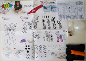 Contents of an I DO 3D pen set, including instruction and tracing sheets, plastic forms, pen tips, a spotlight and a bag with pens in it.