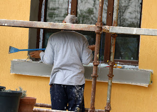 Scraping off the rubbish from the window ledge Scraping off the rubbish from the window ledge