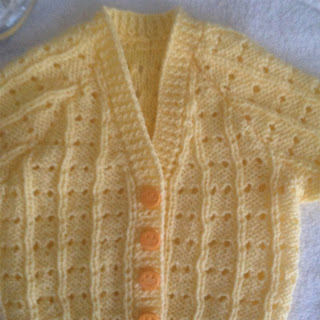 https://www.craftsy.com/knitting/patterns/lily-s-eyelet-baby-cardigan/491500