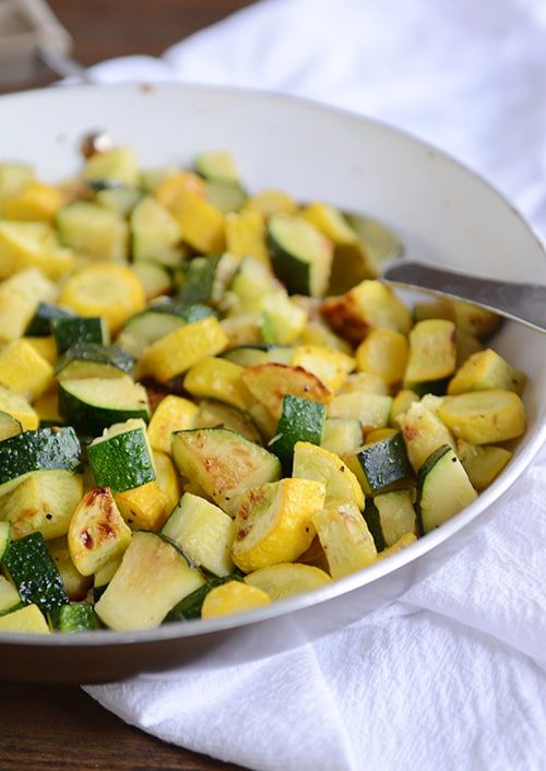 This skillet zucchini and yellow squash is delicious, healthy, and bound to become a summer side dish staple. #zucchini #yellowsquash #healthy #garden #sidedish #melskitchencafe