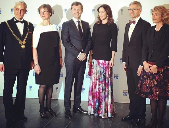 Crown princess mary wore Dolce and Gabbana floral skirt and carried Carlend Copenhagen Vanessa red Clutch bag