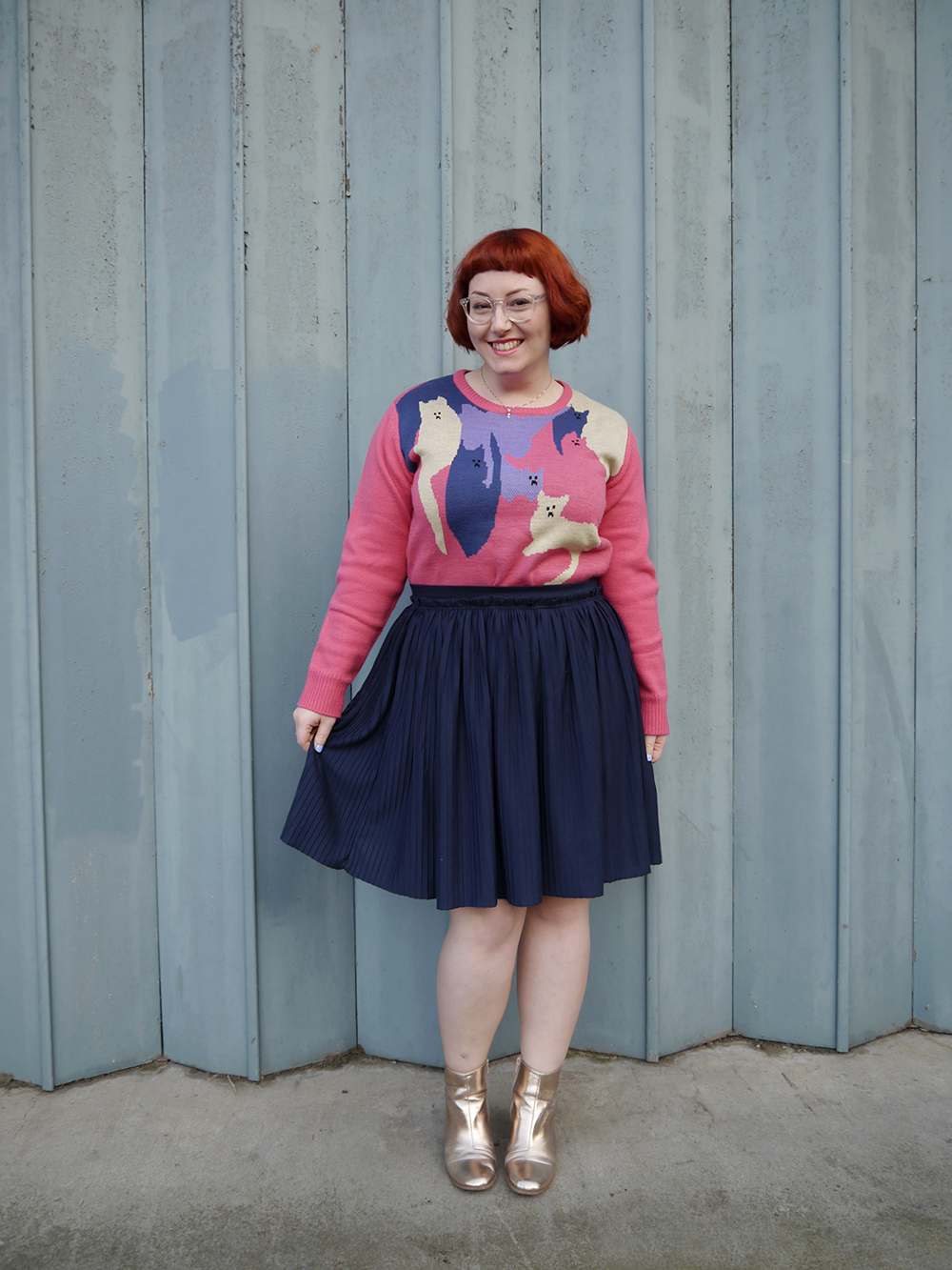 Fun cat themed outfit Styled by Helen, Scottish blogger, Dundee blogger, Scottish fashion blogger, quirky style, Scottish street style, cute style, cat clothing, dressing to a theme, cat themed clothing, cat jumper, colourful outfit, colourful street style, La La Land, colourful cat jumper, pink jumper, pink and blue outfit, red head, ginger bob, clear glasses, Iolla glasses, cat necklace, silver cat necklace, gold boots, cat pose, cute cat outfit, Wardrobe Conversations