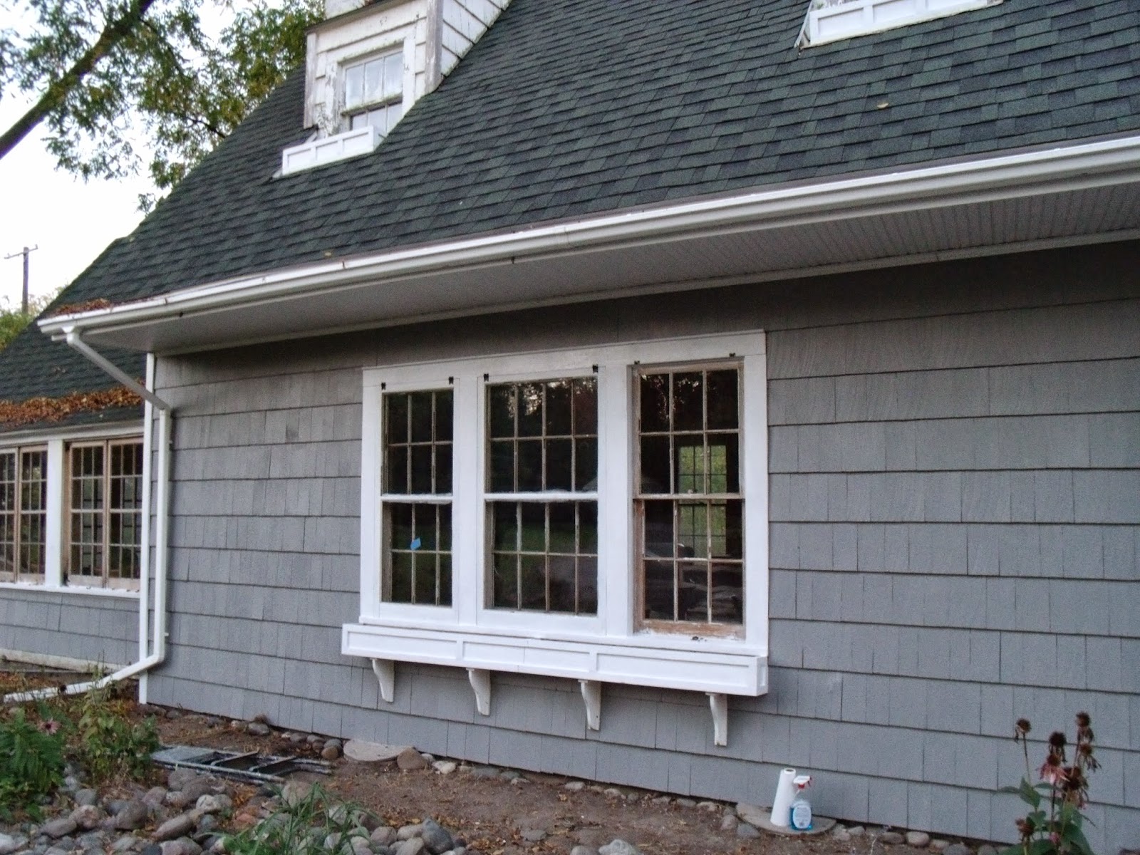 Gear Acres at Top of the Hill Rehanging the Wood Storm Windows