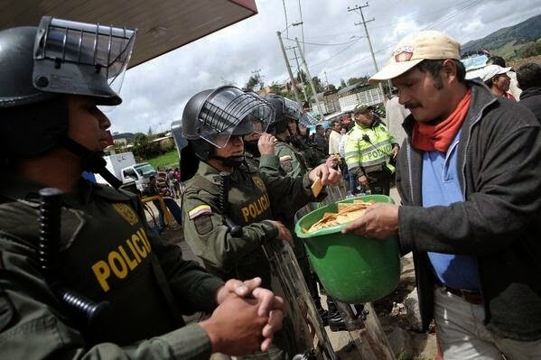 35 moments of violence that brought out incredible human compassion - protesters share crackers with colombian riot police