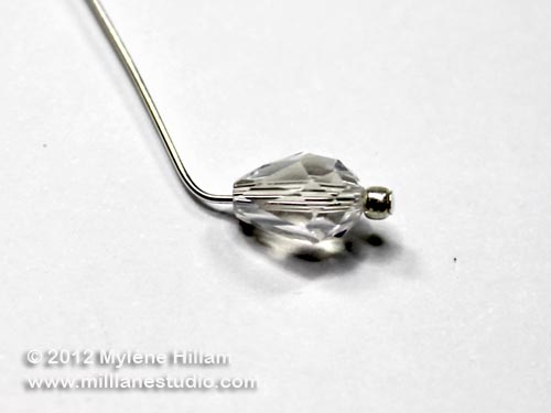 Teardrop crystal strung on a ball head pin