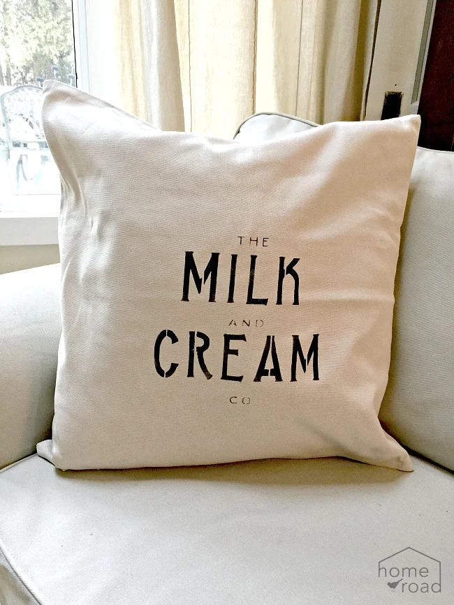 Stenciled Milk and Cream farmhouse pillow covers.