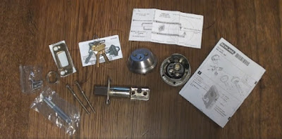 Unboxed Schlage double cylinder lock set contents displayed