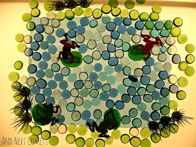 Create a frog pond small world on the light table to encourage imaginative play from And Next Comes L
