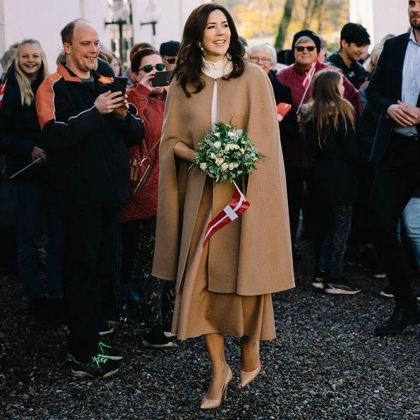 Crown Princess Mary wore Oscar De La Renta camel hair wool-blend cape, CO wool sweater, Naledi Copenhagen clutch