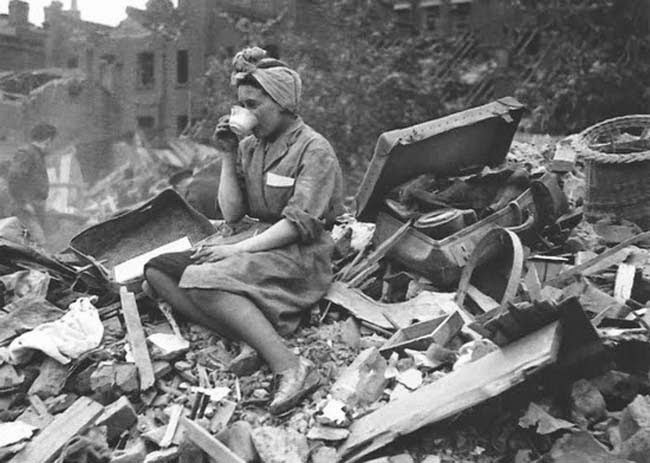 52 photos of women who changed history forever - A woman drinking tea in the aftermath of a German bombing raid during the London Blitz. [1940]