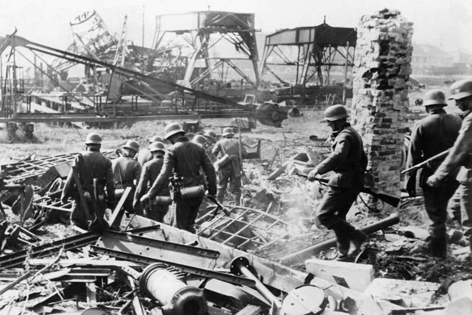 German soldiers comb the Westerplatte after it was surrendered to German units from the Schleswig-Holstein landing crew, on September 7, 1939. Fewer than 200 Polish soldiers defended the small peninsula, holding off the Germans for seven days.