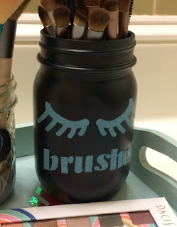 Painted mason jar with cricut glitter vinyl for makeup brushes