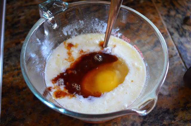 Melted Butter, Buttermilk, Eggs, and Vanilla in a measuring cup.