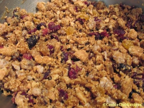 crushed graham crackers with dried fruit and honey
