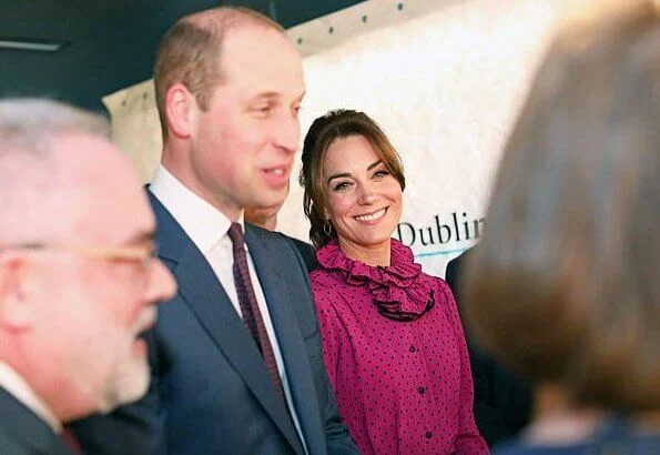 Kate Middleton wore a vintage polka-dot print and ruffle neckline dress by Oscar De La Renta, carried Jimmy Choo Celeste clutch