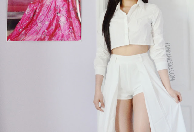 Morrisday the Label Fashion Review: Playsuits + Flowy Skorts An all-white outfit featuring the Midnight in Paris flowy white maxi skort from Morrisday the Label, paired with a cropped white button-down shirt and white spiked platform booties.