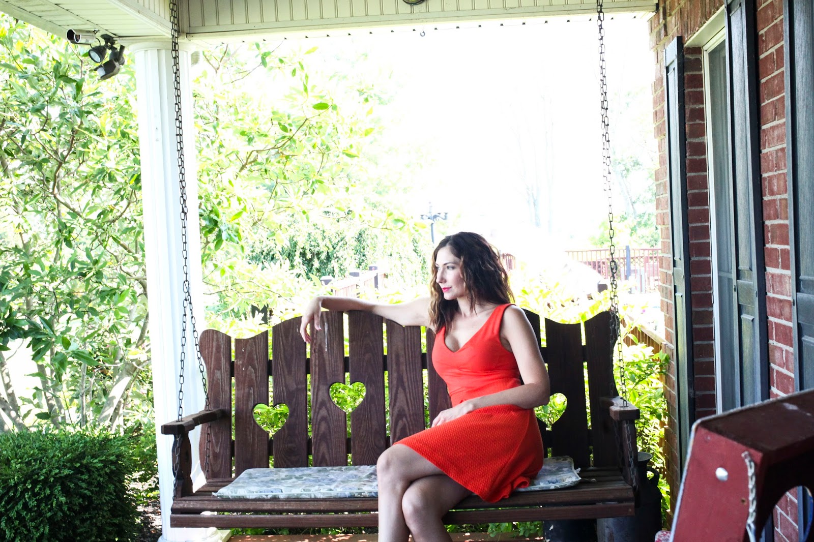 A casual look can be easily dressed up with the right styling Amy West relaxing on porch swing in Kentucky