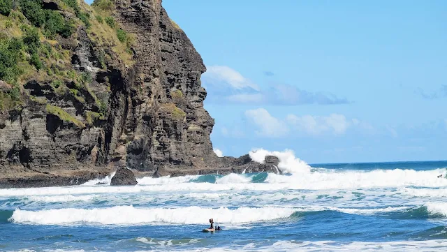 Surfers at Piha Beach near Auckland New Zealand