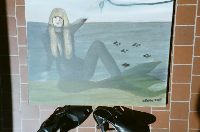 peinture à l'huile représentant une sirène blonde