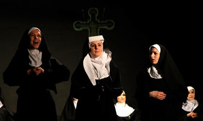 Close up of Mother Abbess with two Sisters