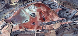 the love bull Moon,Spain fields from the air, abstract photograph of the Spain fields from the air, which mimic an abstract painting the love bull Moon,Spain fields from the air, artistic representation of human labor camps bird's eye view,