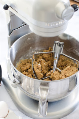 Mixer filled with peanut butter cookie dough.