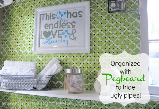Laundry Room wall with pegboard to cover ugly pipes | OrganizingMadeFun.com