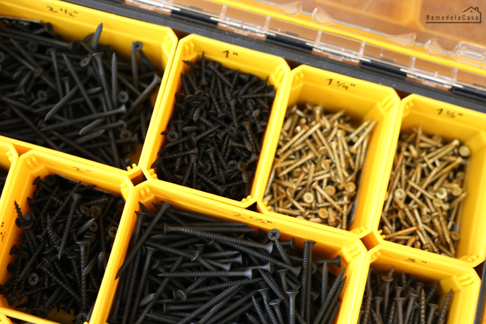 screws organized in a Dewalt yellow small parts organizer
