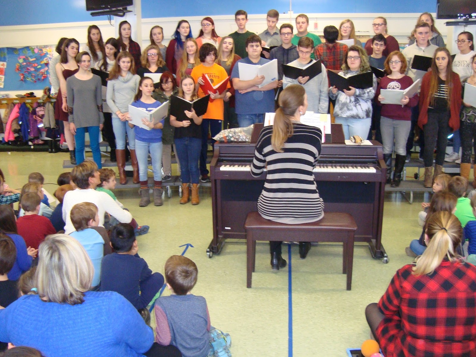 Mrs. Kelly's First Grade Class High School Choir Performance