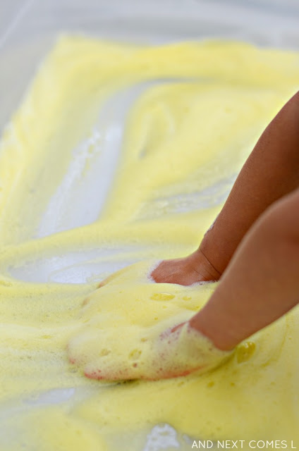 Lemon scented soap foam sensory bin for toddlers and preschoolers