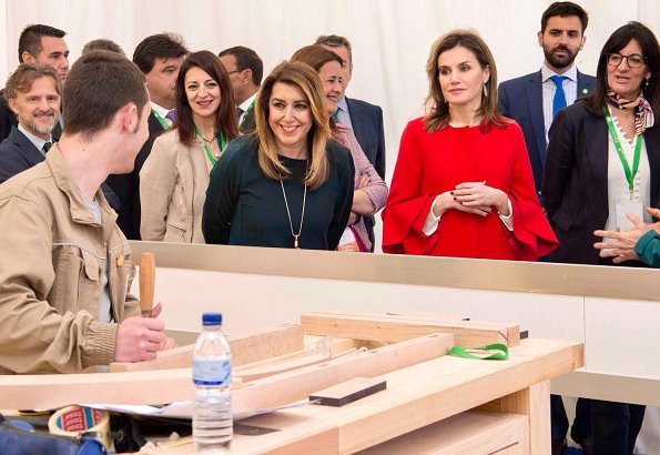 Queen Letizia wore Zara frilled sleeve coat and wore Lodi Saray Pumps, she carried Carolina Herrera red python clutch at AndalucíaSkills event