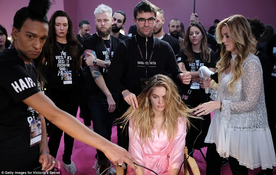 Models put on busty displays backstage at the 2016 Victoria's Secret Fashion Show in Paris