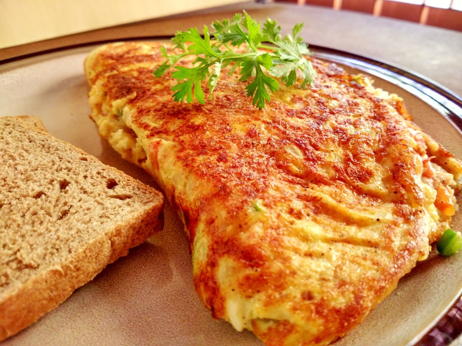 Cheesy Chicken filled Omelette Garlic Chicken Omelette Tempting Treat