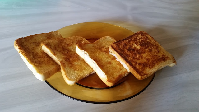 A delicious four piece French Toast dish in amber colored glass plate