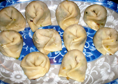 SHIITAKE MUSHROOMS AND LEEKS WONTONS PORTIONS: 22 INGREDIENTS 2 tbsp. vegetable oil 1 minced garlic clove 1 tsp. minced ginger ¼ cup diced onions 1½ cups finely diced leeks 2 cups finely diced shiitake mushrooms ½ cube chicken bouillon without MSG 1 tbsp. soy sauce ¼ tsp. ground pepper ¼ cup water ½ tsp. cornstarch 22 wonton wrappers 1 beaten egg or water DIRECTIONS In a small bowl, mix soy sauce, water and dissolve cornstarch.  Heat a frying pan with the oil and stir fry garlic, ginger and onions together. Add leeks and shiitake mushrooms. Cover and let them sweat for 3 minutes. Add chicken base and dissolve it in the mix. Incorporate the liquid mix and thicken the vegetables. Let it cook for 1 minute. Put the mix in a dish and place in refrigerator to cool off. On the preparation table place the wonton sheets and with 1 tsp .of the mixture fill in the center. Wet the wrapper edges and roll it. Bend the ends and tighten them together. Freeze the wontons until you are ready to use them. You can steam it, fry them or use them in soups. INGREDIENTS 2 tbsp. vegetable oil 1 minced garlic clove 1 tsp. minced ginger ¼ cup diced onions 1½ cups finely diced leeks 2 cups finely diced shiitake mushrooms ½ cube chicken bouillon without MSG 1 tbsp. soy sauce ¼ tsp. ground pepper ¼ cup water ½ tsp. cornstarch 22 wonton wrappers 1 beaten egg or water DIRECTIONS In a small bowl, mix soy sauce, water and dissolve cornstarch.  Heat a frying pan with the oil and stir fry garlic, ginger and onions together. Add leeks and shiitake mushrooms. Cover and let them sweat for 3 minutes. Add chicken base and dissolve it in the mix. Incorporate the liquid mix and thicken the vegetables. Let it cook for 1 minute. Put the mix in a dish and place in refrigerator to cool off. On the preparation table place the wonton sheets and with 1 tsp .of the mixture fill in the center. Wet the wrapper edges and roll it. roll it. Bend the ends and tighten them together. Freeze the wontons until you are ready to use them. You can steam it, fry them or use them in soups.