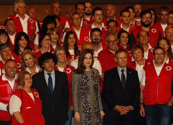 Queen Letizia wore Carolina Herrera Prince Of Wales Floral Cutout Dress. Letizia wore Magrit pumps at Red Cross Day event