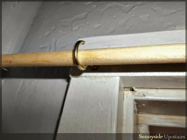 Use cup hooks to hang a curtain dowel rod