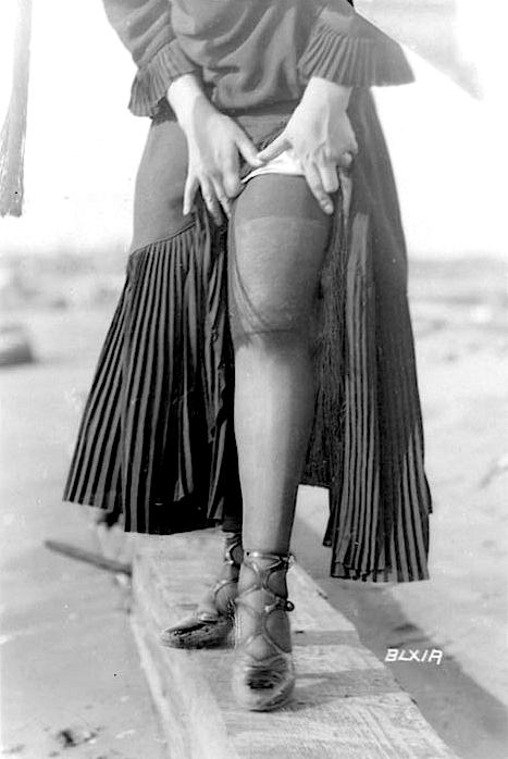sexy leg photograph around 1900, a woman showing her stockinged leg