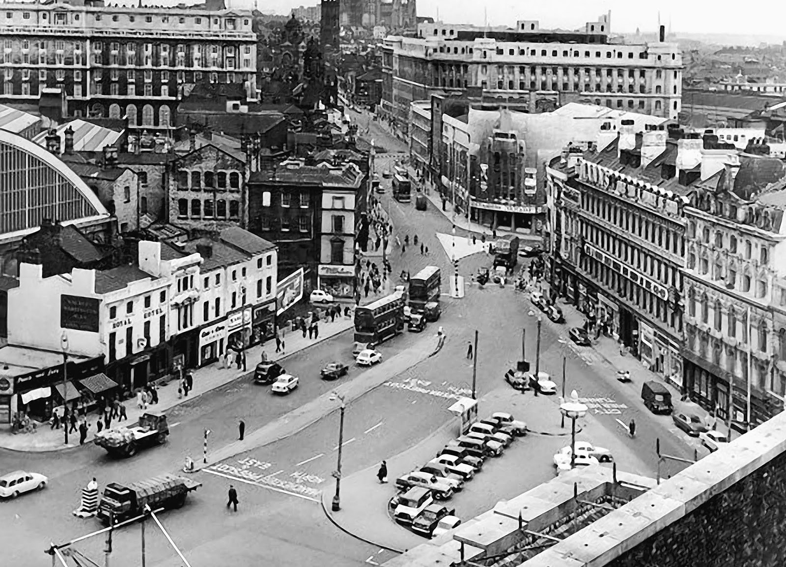 A view down onto Lime Street, showing the original shops in front of the station, and the row of buildings known as St George's Place.