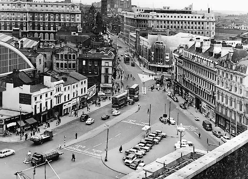 An old photograph of Lime Street, Liverpool, taken from a high vantage point looking down onto traffic