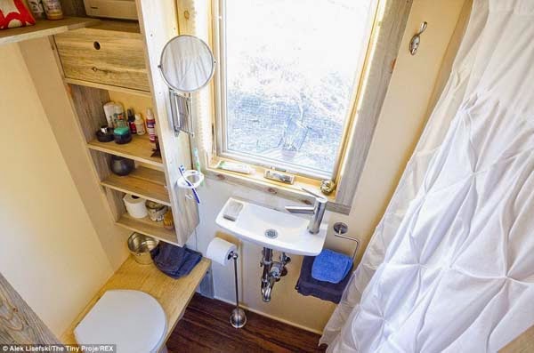 The bathroom is small but functional. The tiny sink doesn’t take up much space, nor does the shower.