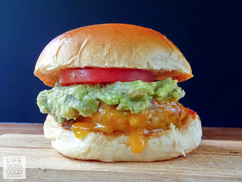 Chicken Cheddar and Guacamole Burgers | by Life Tastes Good are smothered in cheddar cheese and topped with a generous helping of guacamole for maximum delicious! #ChickenBurgers #Sandwich