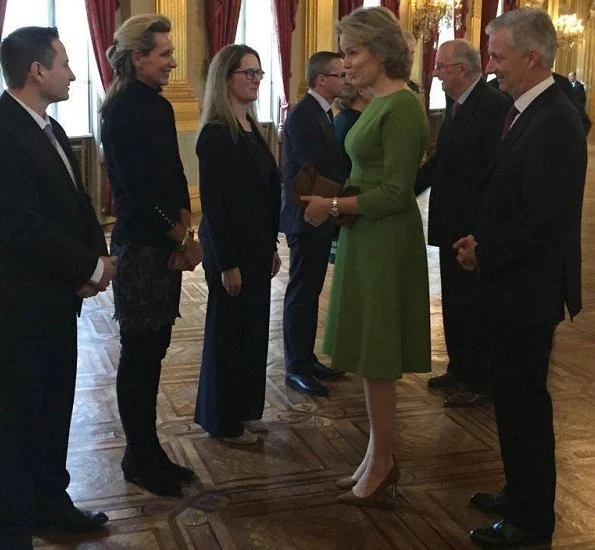 King Philippe, Queen Mathilde, King Albert and Prince Laurent at Combating Human Trafficking seminar. Natan dress