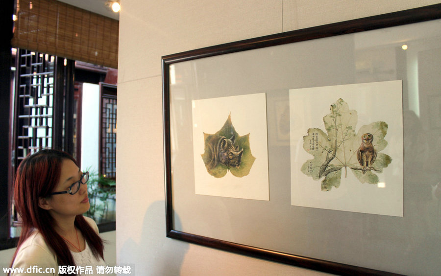 06-Rhino-and-Owl-Pang Yande-Leaf-Painting-Folk-Art-and-Environmental-Protection-www-designstack-co