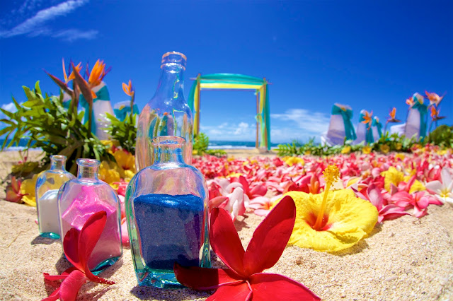 Hawaii beach wedding with pink white and blue sand bottles
