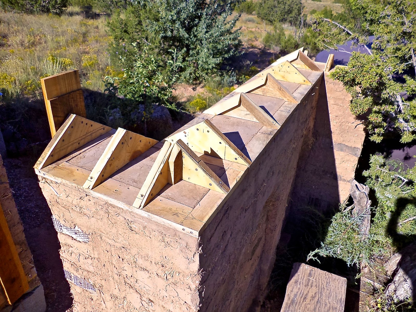 Alt. Build Blog Building An Adobe Wall 4 Putting On The Cap